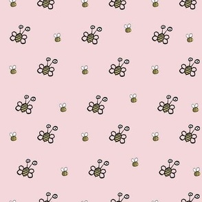 Sweet flying hand drawn bees on pink