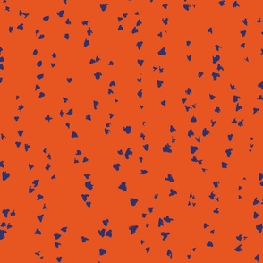 painted blue dots on orange background