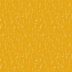 small beige painted dots on yellow background
