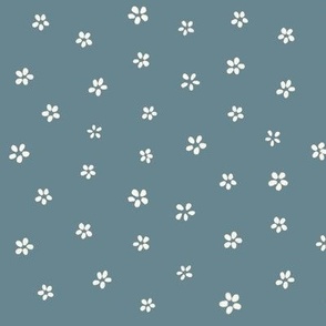 Tiny, Simple, White Flowers Dancing Across Soft Blue Green Background