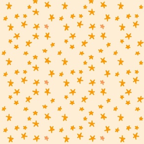 Yellow gold textured drawn party star scattered on butter lemon