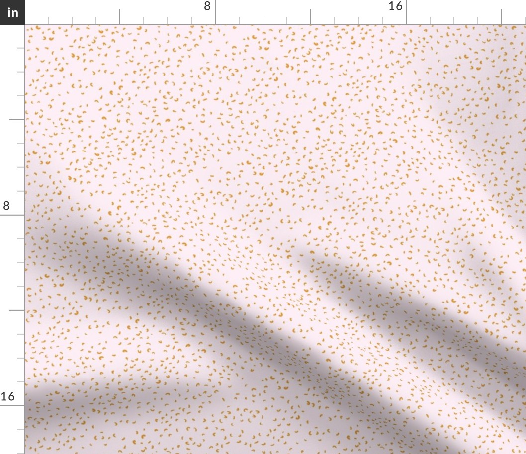 Ditsy scattered dots and dashes in lilac pink and orange rust