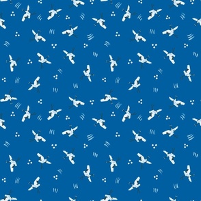 Cranes flying in the blue
