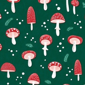 Christmas crimson red  mushrooms on dark green with  fur tree branches 