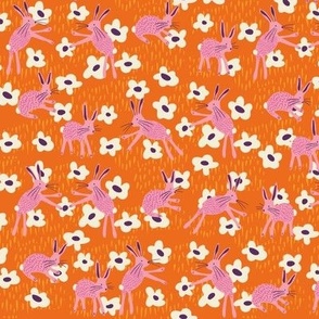 Rabbits (orange) 12" - Pink rabbits playing amongst the white flowers in this folk style bunny and daisy design.  Also available in my tea towel collection and other colorways.