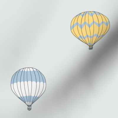 Cute floating hot air balloons in red blue yellow