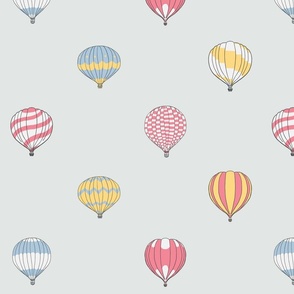 Cute floating hot air balloons in red blue yellow