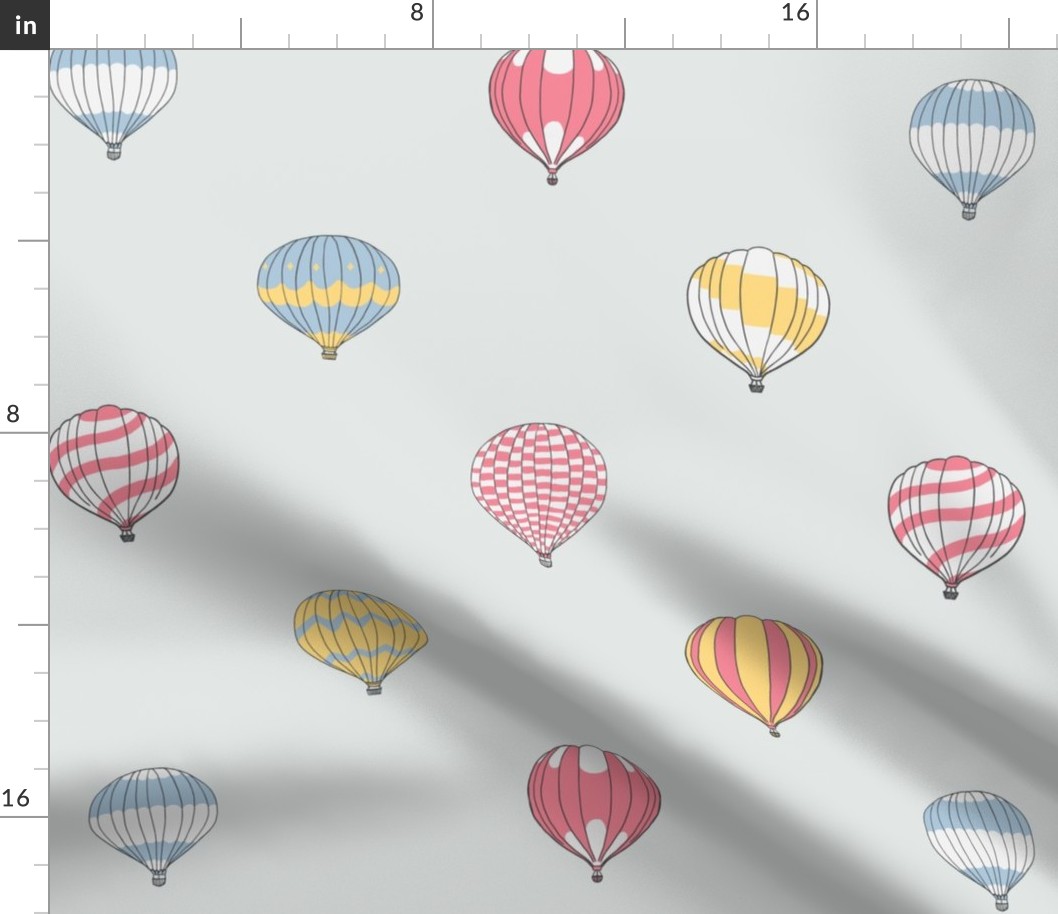 Cute floating hot air balloons in red blue yellow