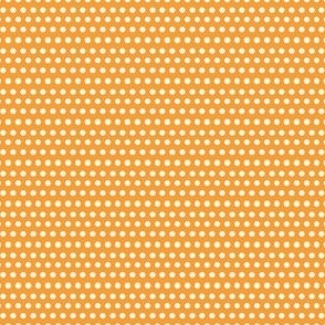 Off-white polka dots on orange background