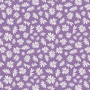 Off-white daisies on darker purple background