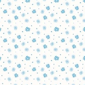 Scattered medium blue daisy on off-white background