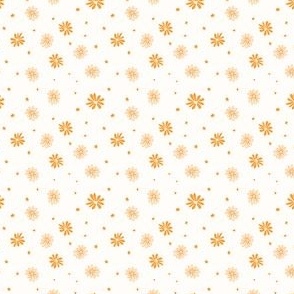 Scattered orange daisy on off-white background