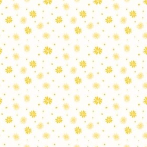 Scattered yellow daisy on off-white background