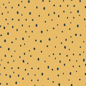 Black dots on gold background