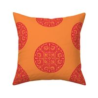 Winged medallion in tangerine orange and red