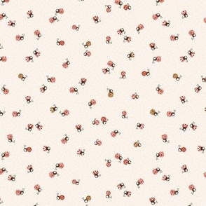 Cute ladybugs on cream, small scale