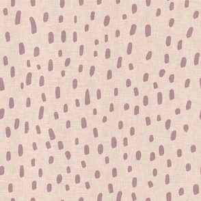 Hand drawn dots and marks in mauve on sand coloured background with a vintage linen texture
