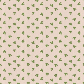 Organic drop shaped green leaves on a linen textured cream background