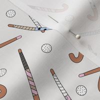 Field Hockey - Hockey sticks and balls tossed freehand boho style sports design pink beige gray on ivory