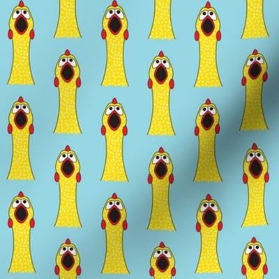 symmetrical rubber chickens on blue