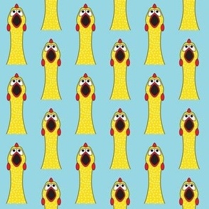 symmetrical rubber chickens on blue