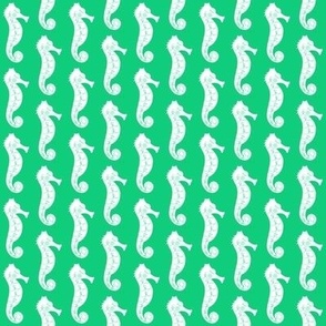 tiny seahorses on green