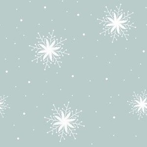 White snowflakes on sea green background