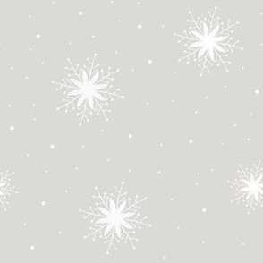 White snowflakes on light grey background