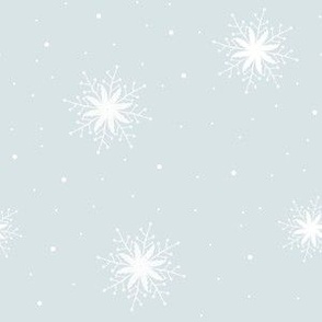 White snowflakes on pale green blue background
