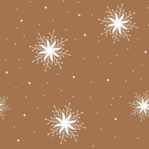 White snowflakes on toffee background
