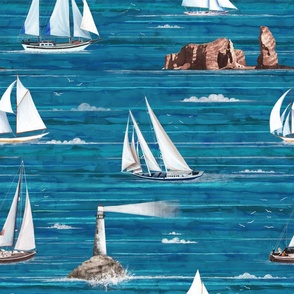 Sailing boats, lighthouse and the isle Helgoland