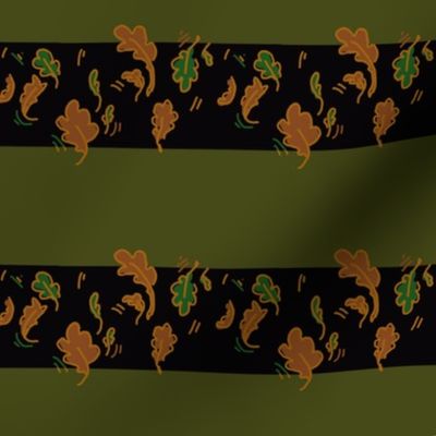 Autumn gold leaf on black and forest green