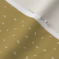 Speckled ocre ditzy dot.  A golden mustard background with scattered textured cream spots.