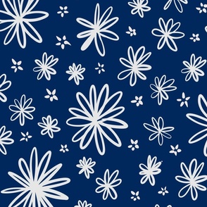 off white flowers and petals on navy blue