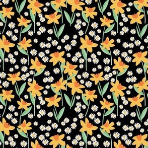 Daffodils and daisies - springtime flowers and leaves summer garden colorful yellow orange mint on black