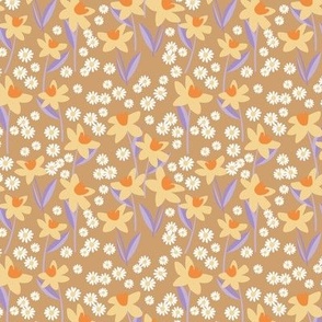 Daffodils and daisies - springtime flowers and leaves summer garden colorful yellow lilac on caramel beige