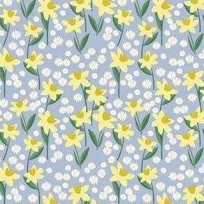 Daffodils and daisies - springtime flowers and leaves summer garden colorful yellow lime green on sky blue