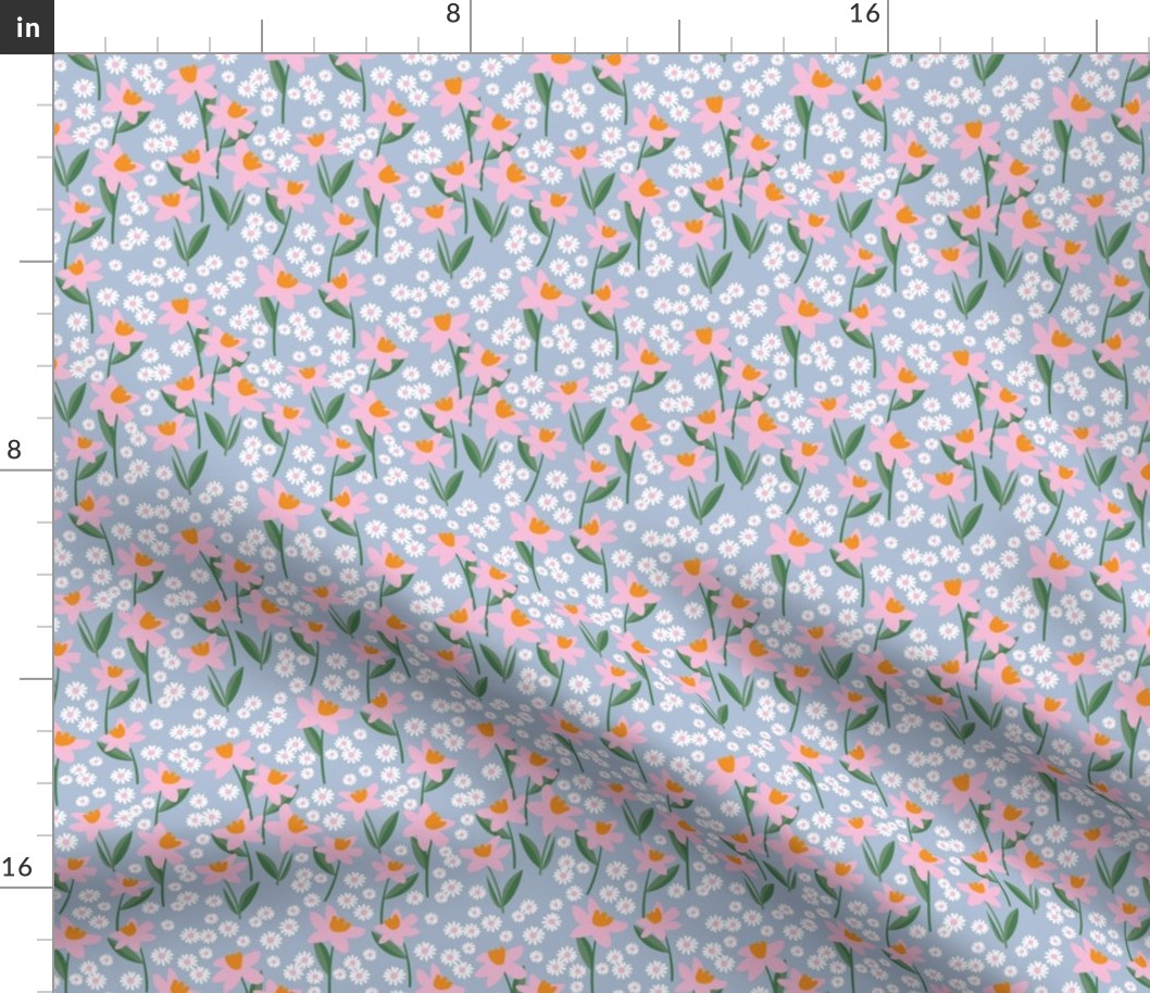 Daffodils and daisies - springtime flowers and leaves summer garden colorful pink pine green orange on sky blue
