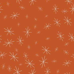 twinkling abstract stars tossed on a sunset orange background