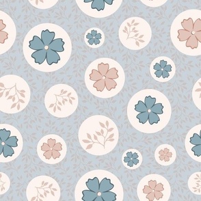 Leaves and flowers in circles on blue background