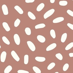 JUMBO - Neutral scattered dots in white over brown background