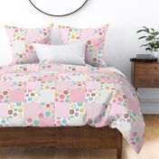 Scattered Rainbow Donuts on pale pink Cheater Quilt - 6 inch patchwork squares
