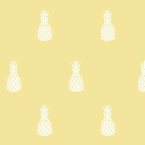 Minimalist pineapples pattern on pastel yellow