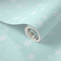 photographic snowflakes on pale ice blue