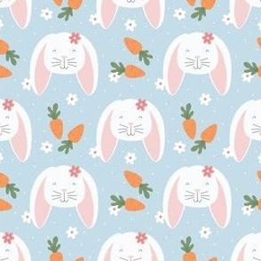 Easter Bunnies and Carrots on Blue Background