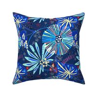 Colorful abstract tropical pattern. Red, blue flowers and leaves on dark blue grunge background.