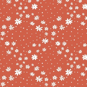 Traditional white dots with white flowers in a modern geometric design on a orange background