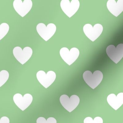 White regular hearts on green - large