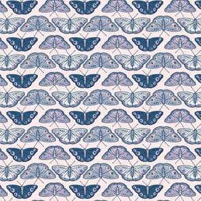 Pretty butterflies in shades of blue and lilac on pastel pink