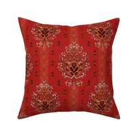 foliate medallion with stripes and motifs on red